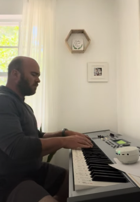 Logan playing piano